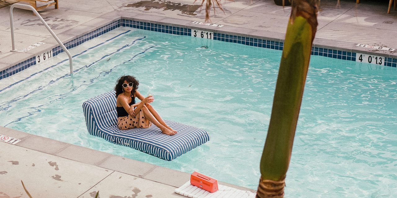 Woman sitting on a floating chair in a pool